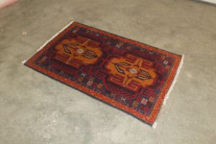 An approx. 4'7" x 2'10" Baluchi rug