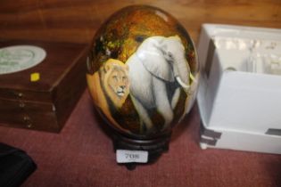 A decorated Ostrich egg on stand