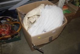 A box of miscellaneous curtains and textiles