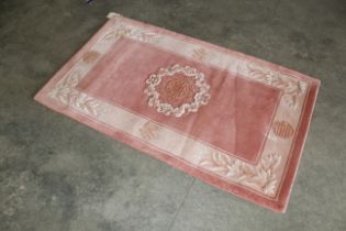 An approx. 5'1" x 3' Chinese wool rug