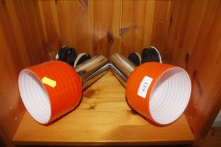 A pair of retro wall lights and shades