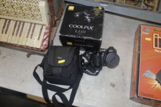 A Nikon Coolpix digital camera with carrying bag a