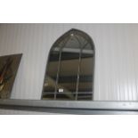 An arched framed wall mirror (148)