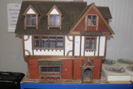 A large dolls house/inn 'Old Swan' and part conten