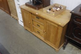 A Oak sideboard fitted three central drawers