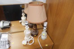 A turned oak table lamp and two Alabasta table lamps