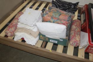 A quantity of linen and cushions