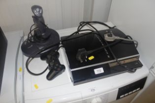 A Sony Playstation3 with controller and joystick