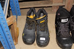 A pair of DeWalt boots size 10