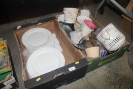Two boxes containing various dinner ware and decor