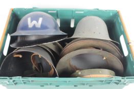 A crate of various helmets, an AF collection