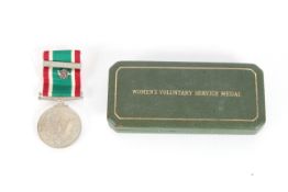 A cased W.R.V.S. Long Service medal with clasp and