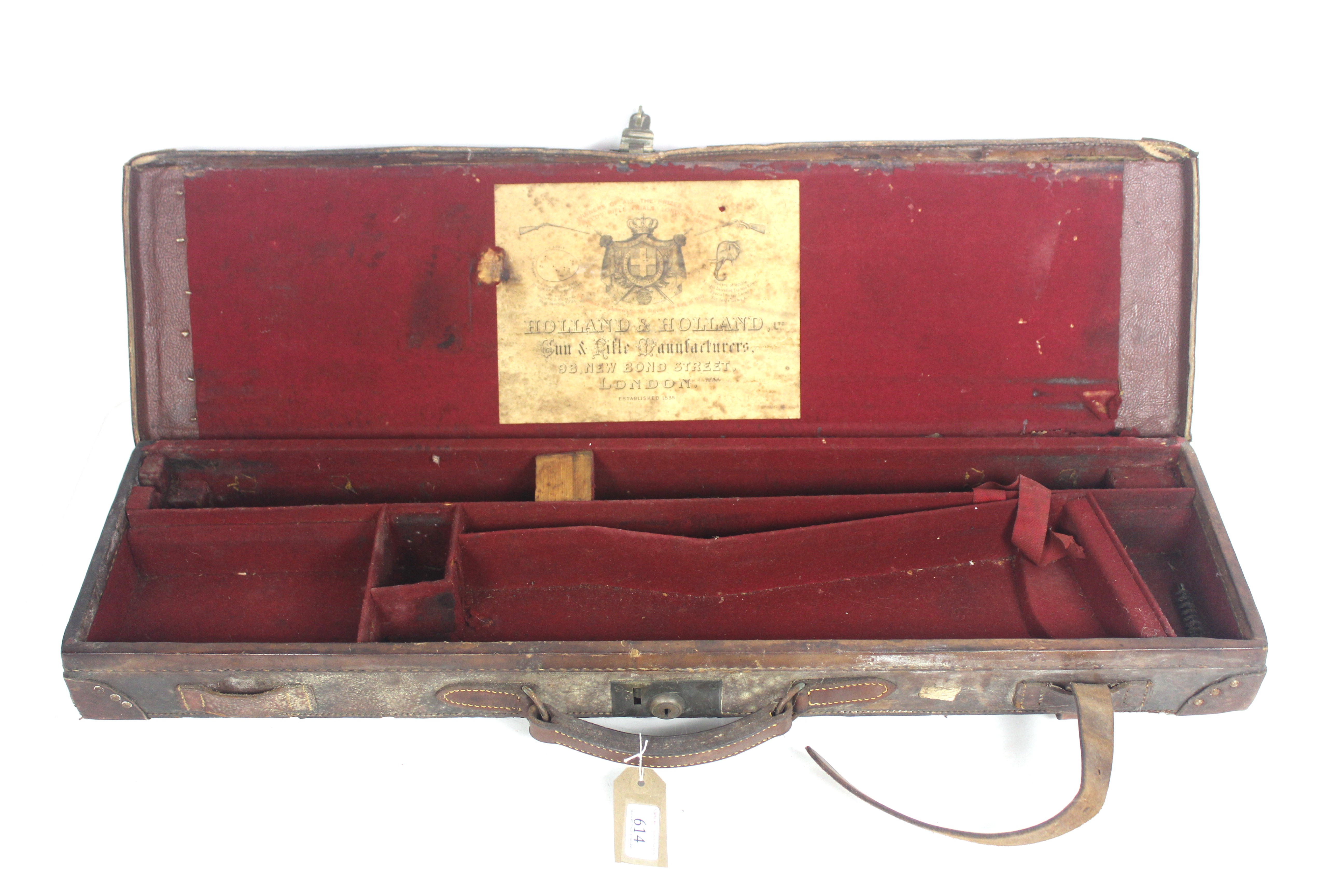 A vintage leather gun case for up to 30" barrels,