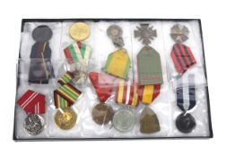 A display case containing eleven various Continent