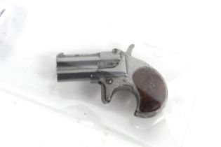 A miniature (non firing) model of a Remington over