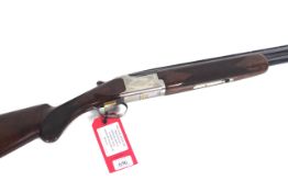 A 16 bore over and under shot gun by Browning, wit