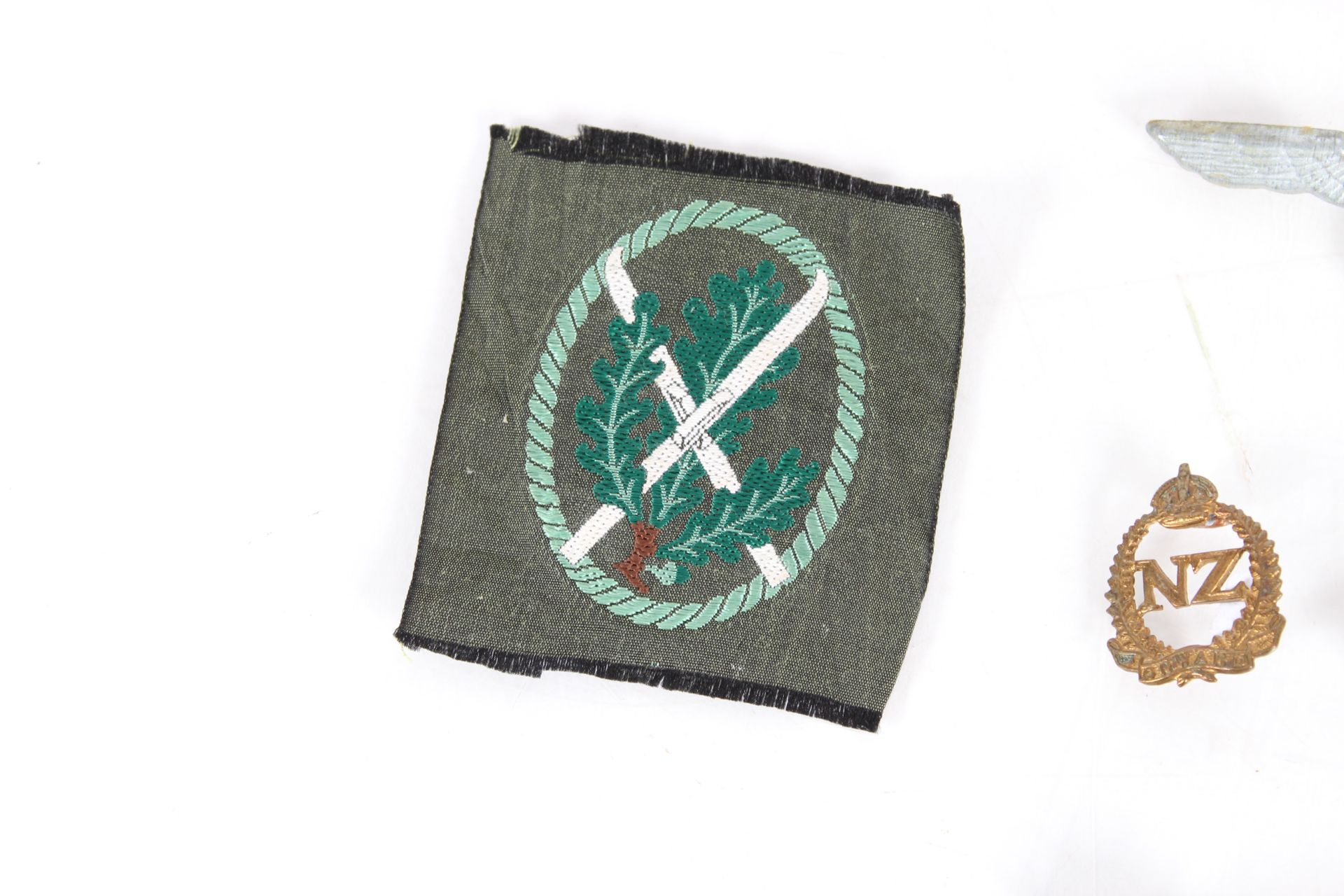 A collection of various military related badges an - Image 2 of 4