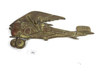 A brass cast plaque of a WWI Nieuport C17 plane