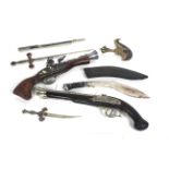 Two decorative pistols with three decorative knive