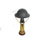 A lamp crafted from brass shell case with dummy he