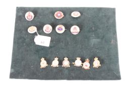 A collection of sweetheart brooches, including R>A