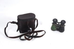 A pair of WWI era binoculars within leather case