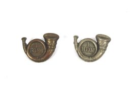 Two cap badges for the 1.R.D.M. (1st Royal Devon M