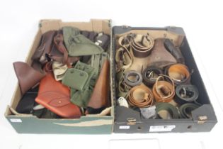 Two boxes of Holsters, rifle slings, pouches, belt