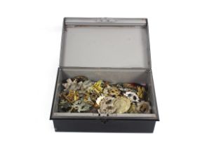 A tin containing over 150 various hat badges etc.