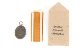 A Third Reich era "Westwall Medal" with correct ri