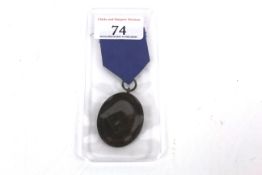 A Third Reich era bronze R.A.D. medal with ribbon