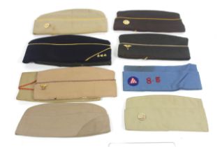 A box containing US Military Garrison hats includi