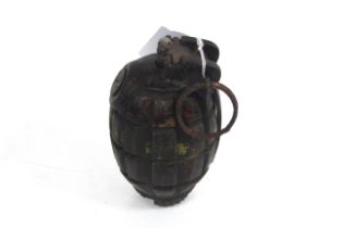 A WWII Mills No. 36 hand grenade, de-activated