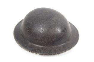 A WWII era A.F.S. helmet with liner and chin strap