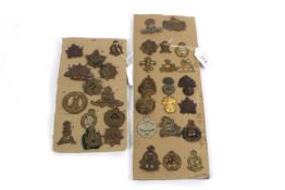 Two cards of various military badges including Com
