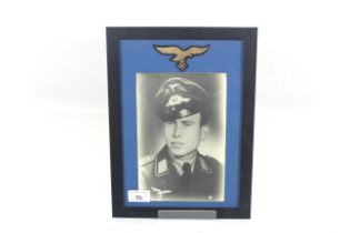 A picture of German airman with cloth eagle above,