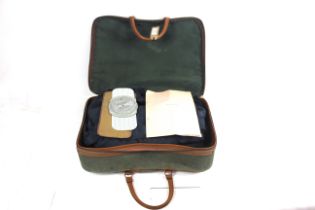 A suitcase containing post war R.A.F. uniforms wit