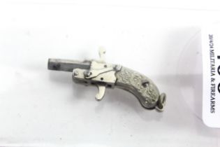 A miniature 2mm pin fire single shot pistol
