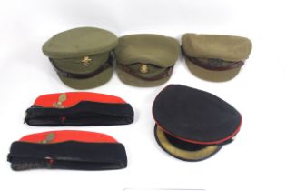 A box containing military officers hats (all havin