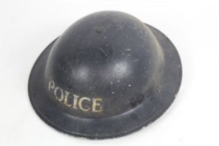 A Home Service helmet marked "Police"