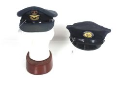 An R.A.F. Officers peaked cap with badge, and a Ca