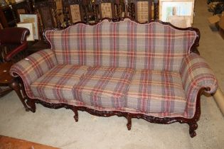 A French style three seater settee, upholstered in