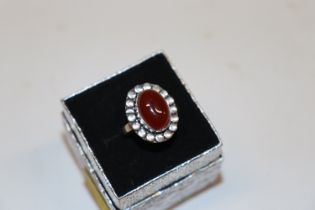 A white metal Carnelian set ring