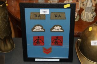 A WWII framed collection of RAF cloth badges