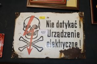 A Ukrainian electric fence enamel sign