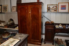 A Victorian mahogany wardrobe fitted sliding trays