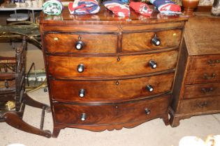 A Georgian mahogany bow fronted chest of two short