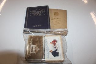 A box containing Royal Commemorative books and a c