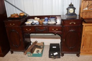 An early 20th Century carved mahogany pedestal sid