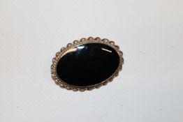 A Sterling silver and Whitby jet brooch in origina